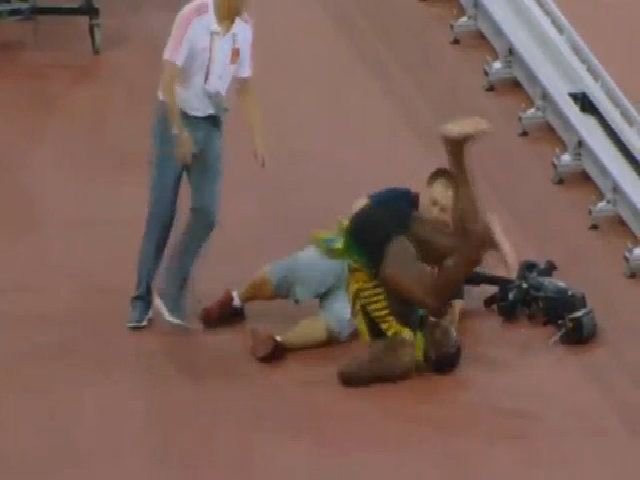 Bolt suffered minor injuries after the cameraman's dive 0